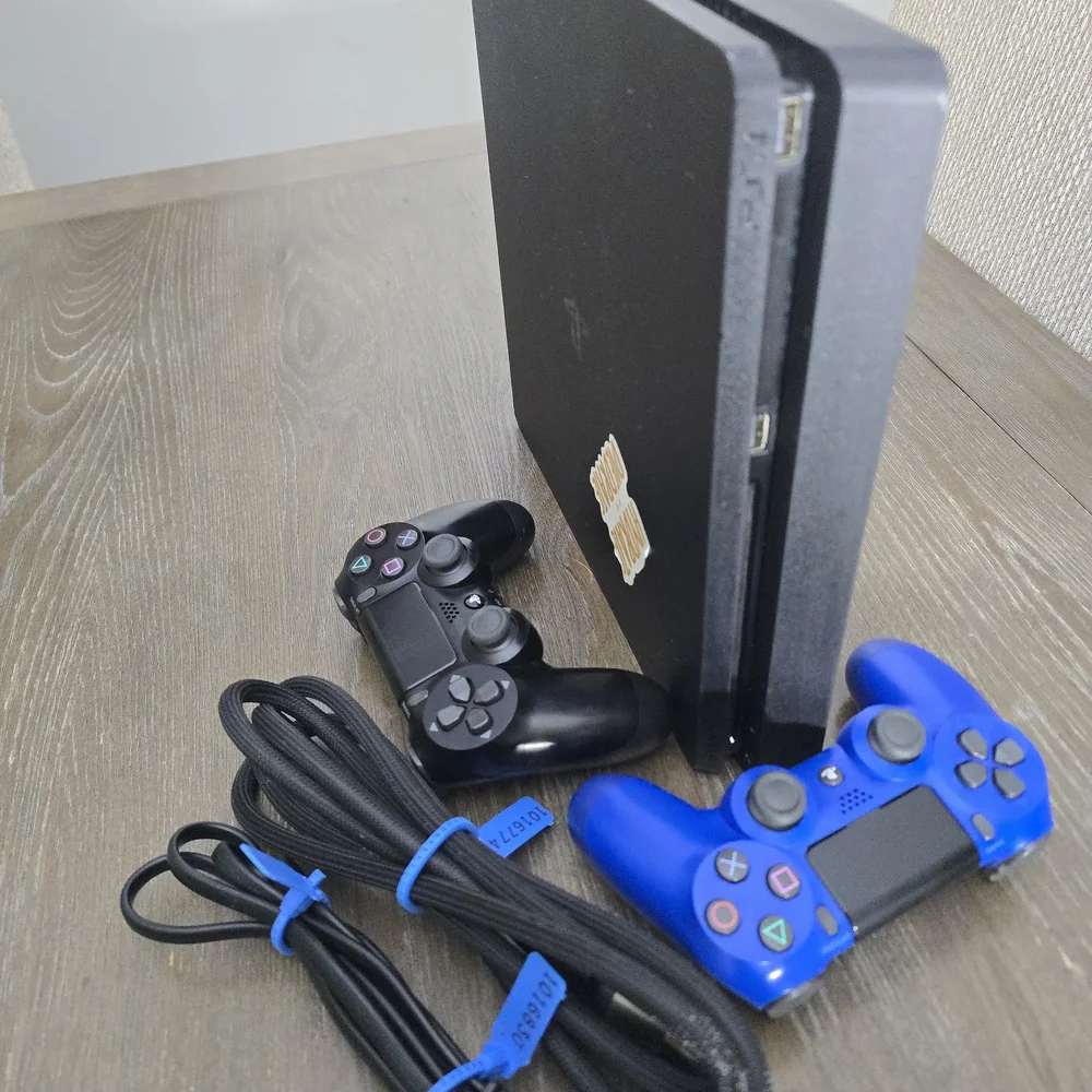Sony PlayStation 4 Console with Black and Blue Controllers